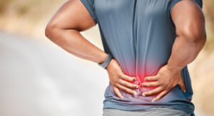 Physiotherapist treating back pain at Naturally Heaven Therapy Newcastle